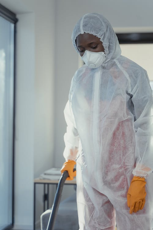 A photo of a person wearing a PPE suit